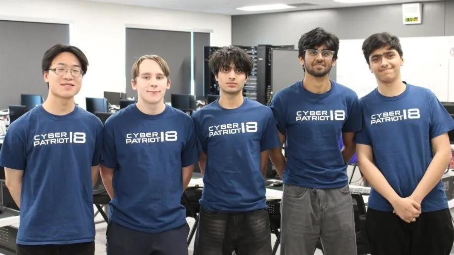 team cybersigmas, five students in cyberpatriot shirts